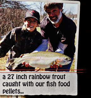 A young boy catches a 27 inch  long rainbow trout with our Fish Food pellets!